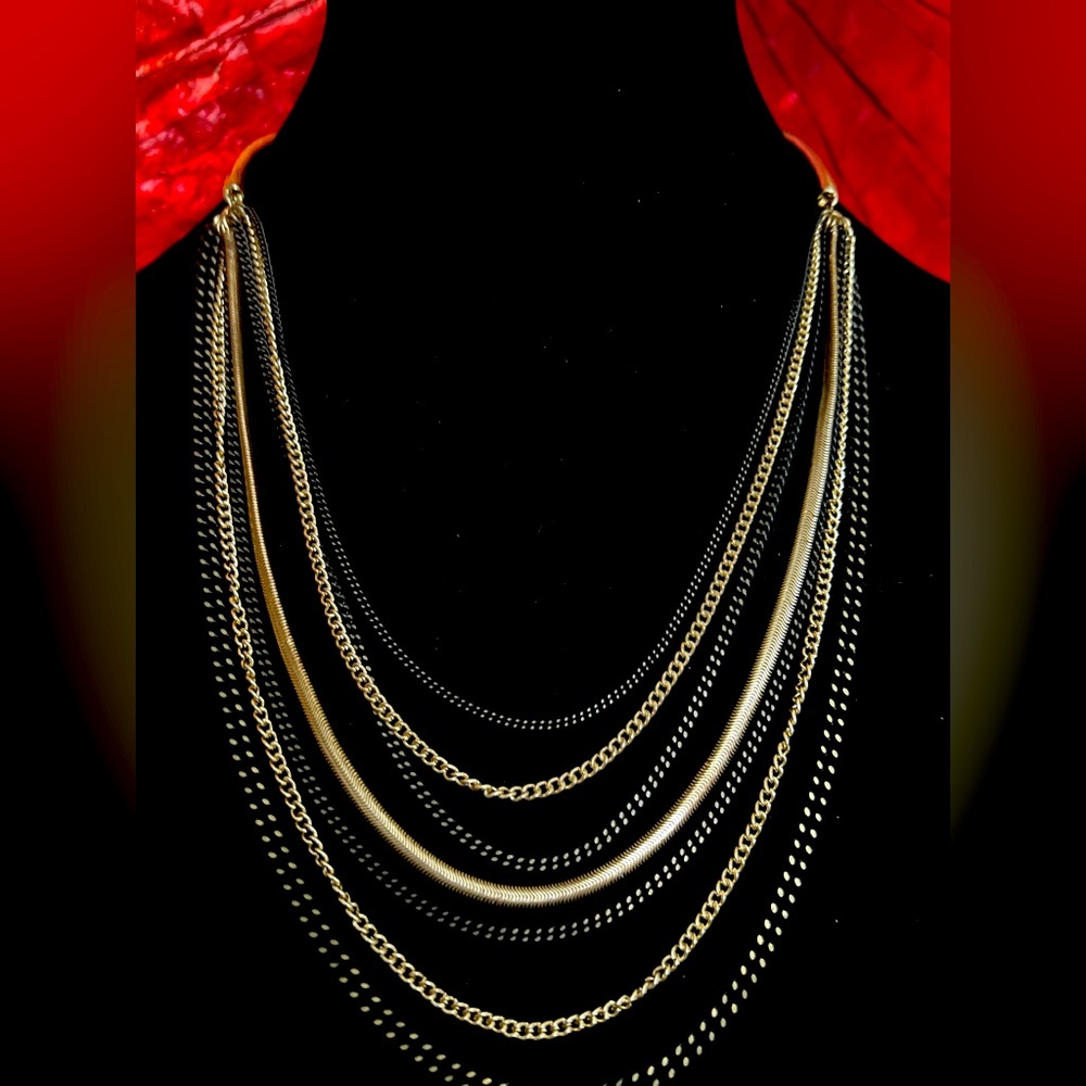 Multi chain necklace black and gold tone.